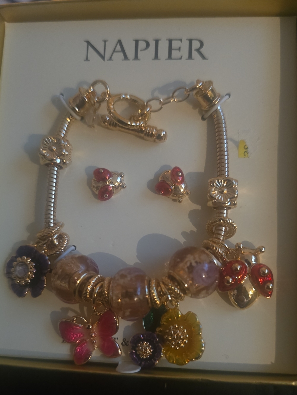 Napier Gold-Tone Bracelet with Pink, Purple, Yellow & Red Enamel Charms